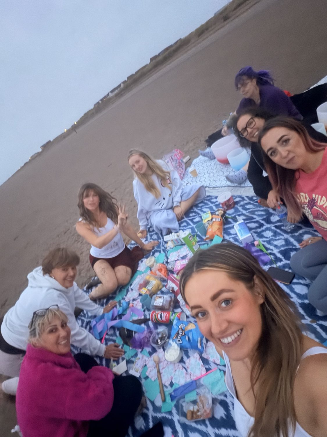 Members of the HELD community together on Crosby beach