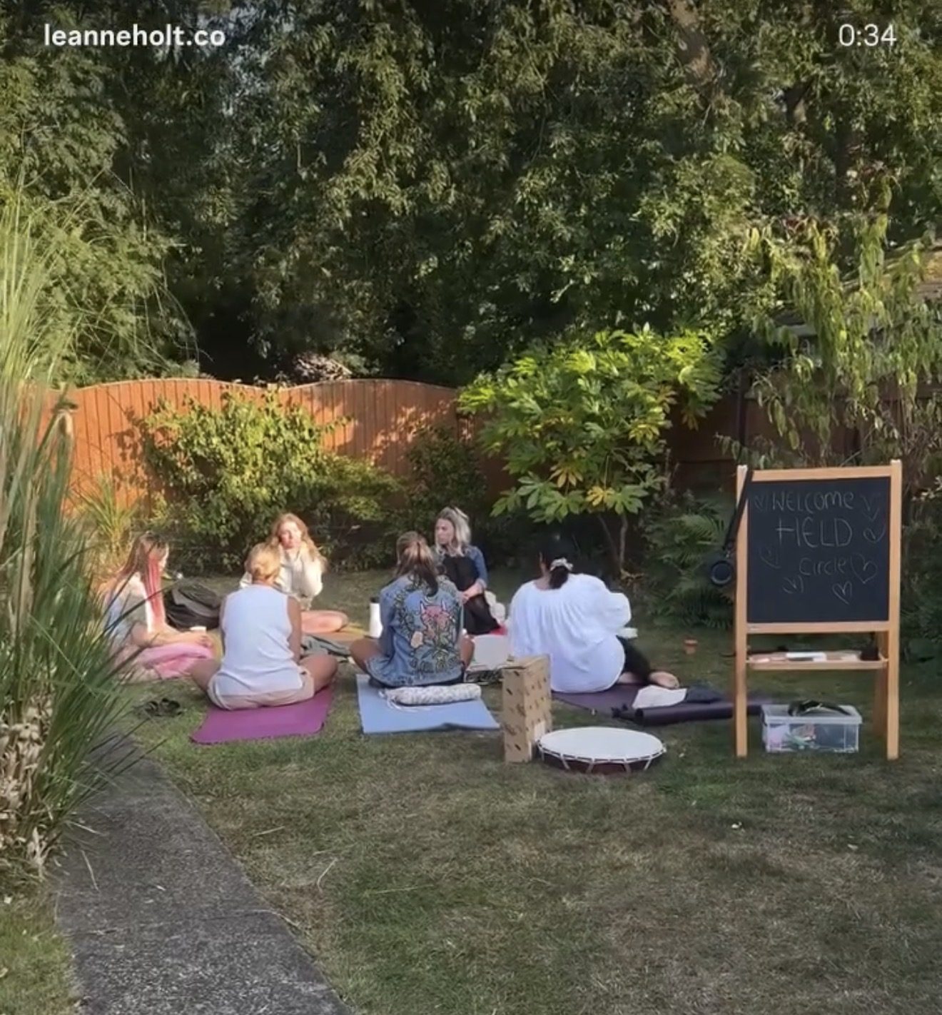 A HELD circle meeting outdoors in a garden