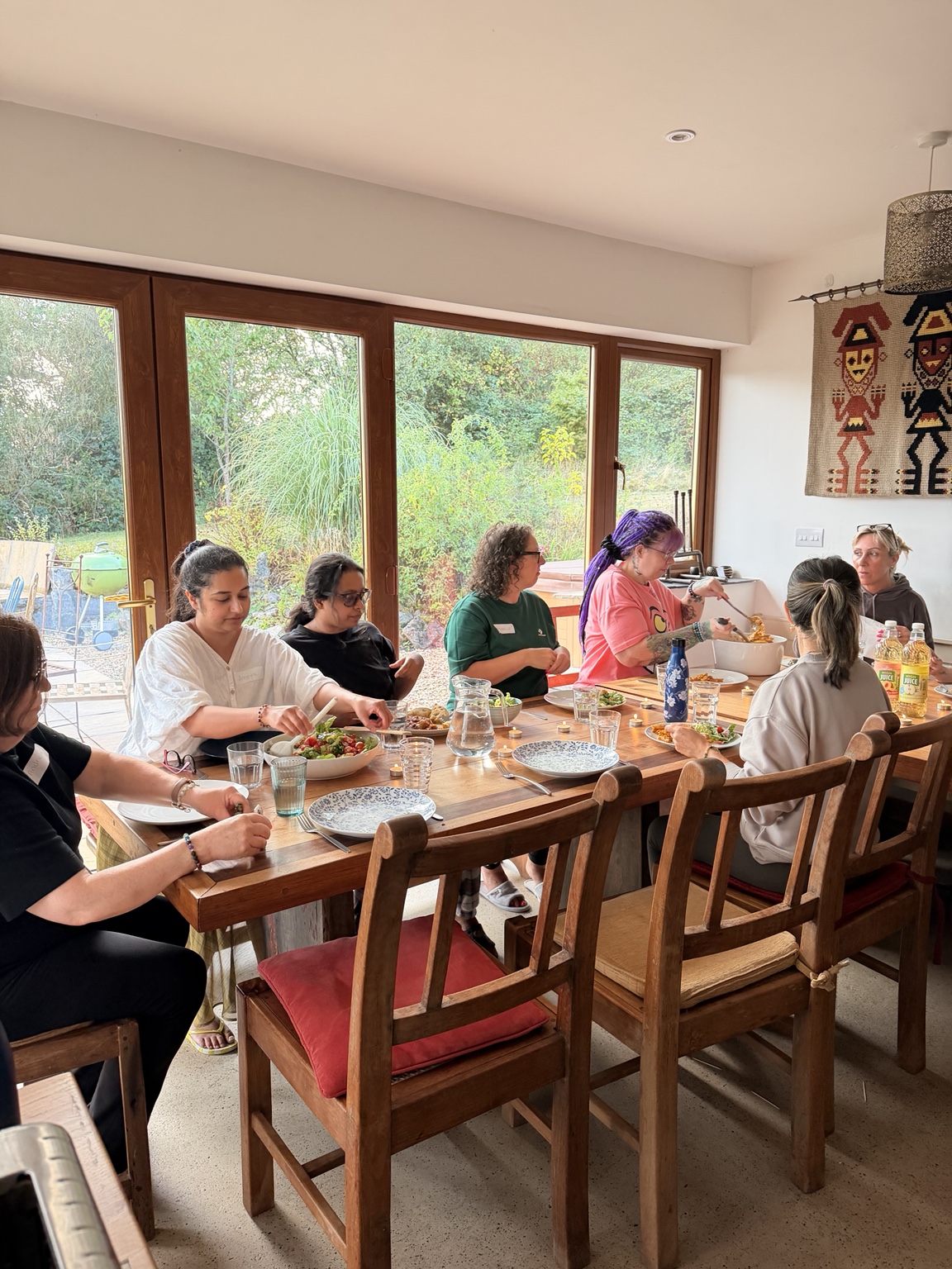 HELD retreat guests sharing a meal around a table