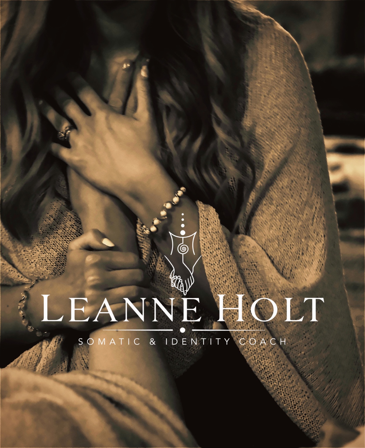 Leanne holding a hand to her heart, with her Somatic and Identity Coach logo